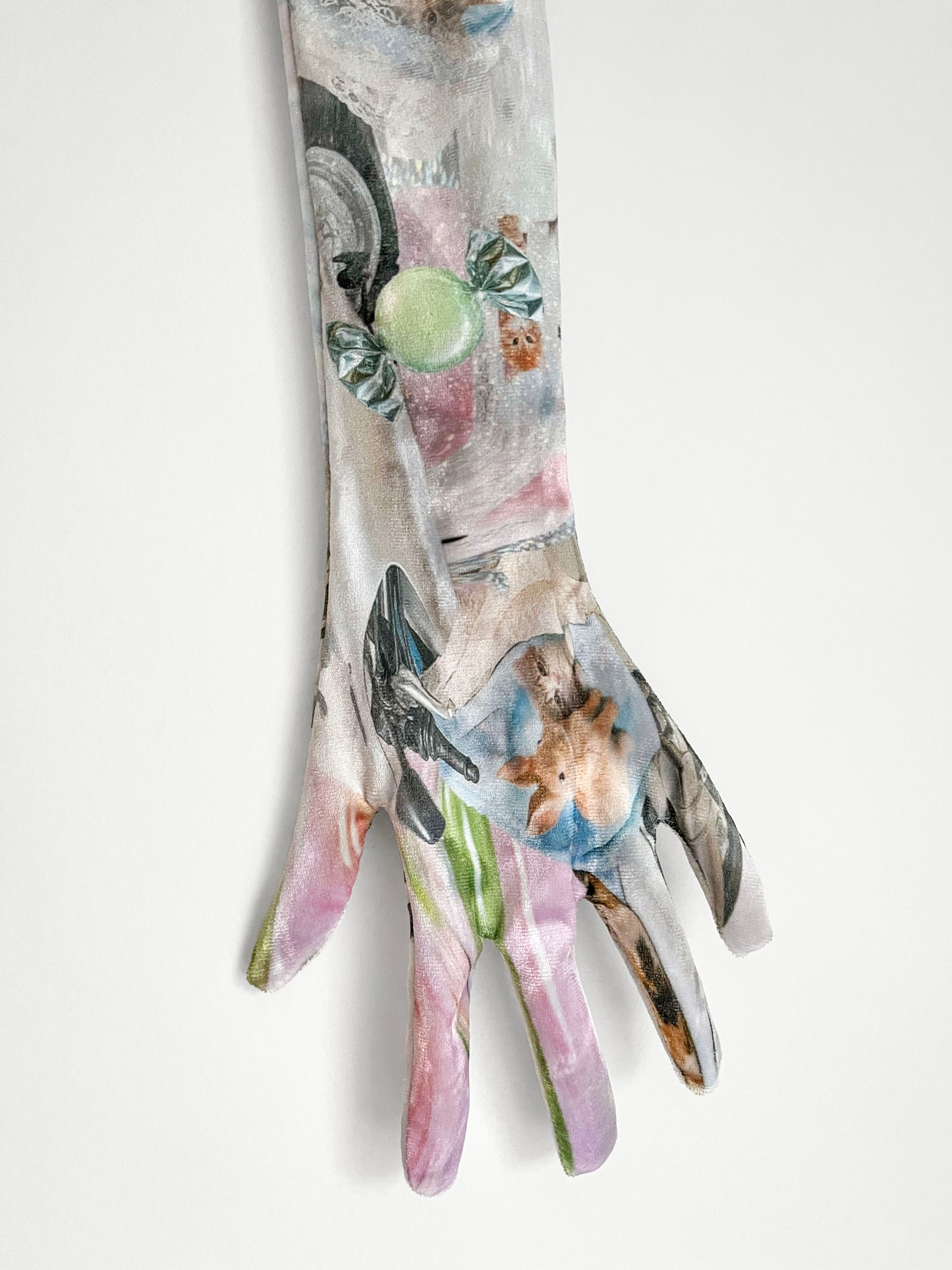 Printed long gloves with nostalgic print design on a white background.