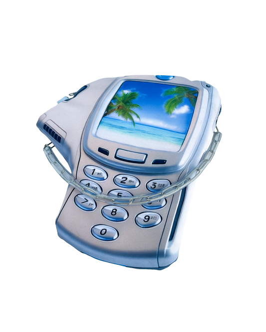 Y2K-inspired silver glitch phone handbag with tropical beach print and distorted mobile shape.