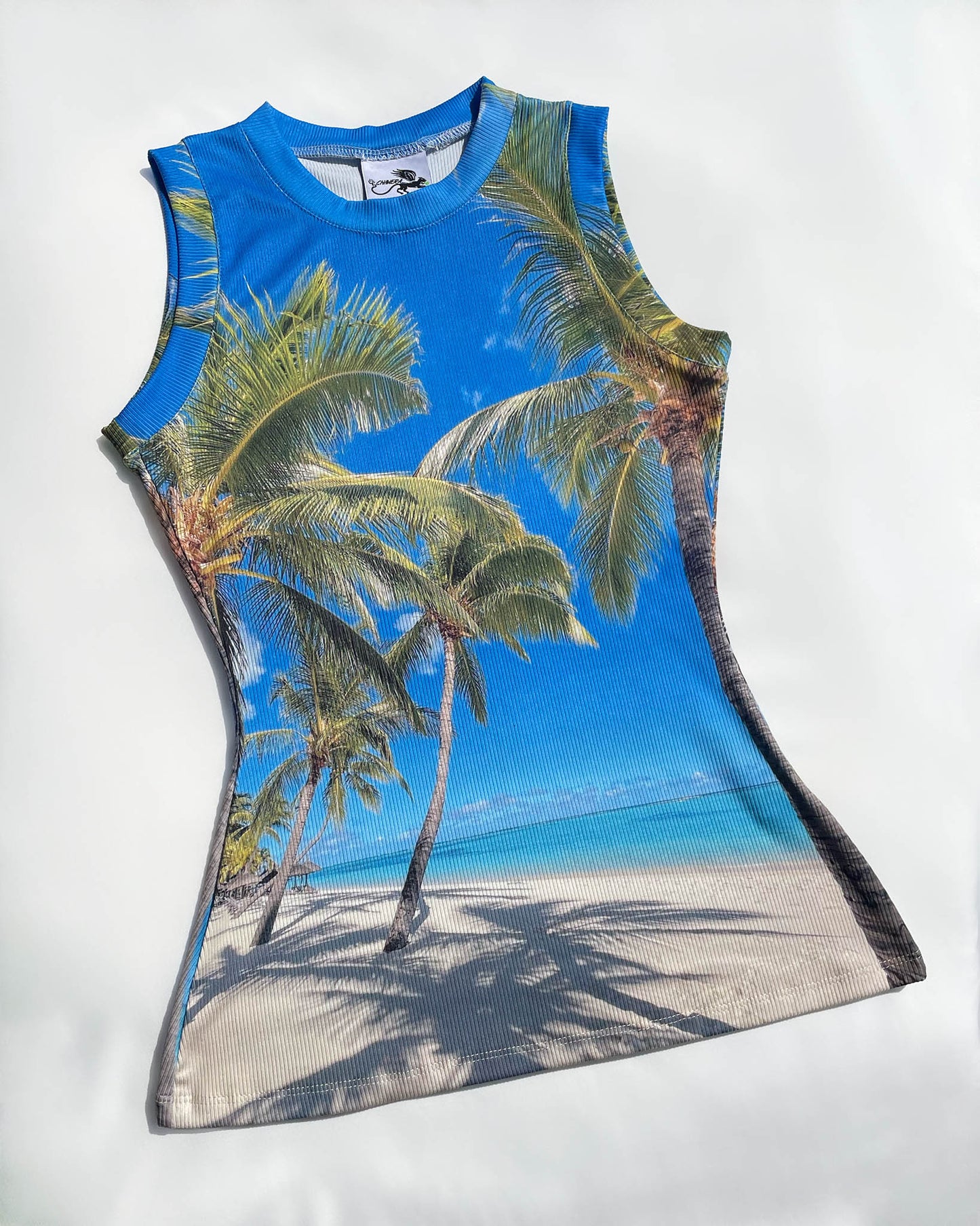 Front view of Tropical.jpeg Top by Chimera Lab laid flat showing digital palm beach print