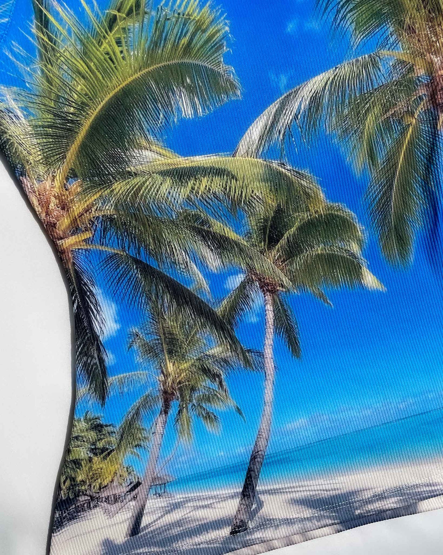 Close-up of palm tree print on Tropical.jpeg Top fabric texture