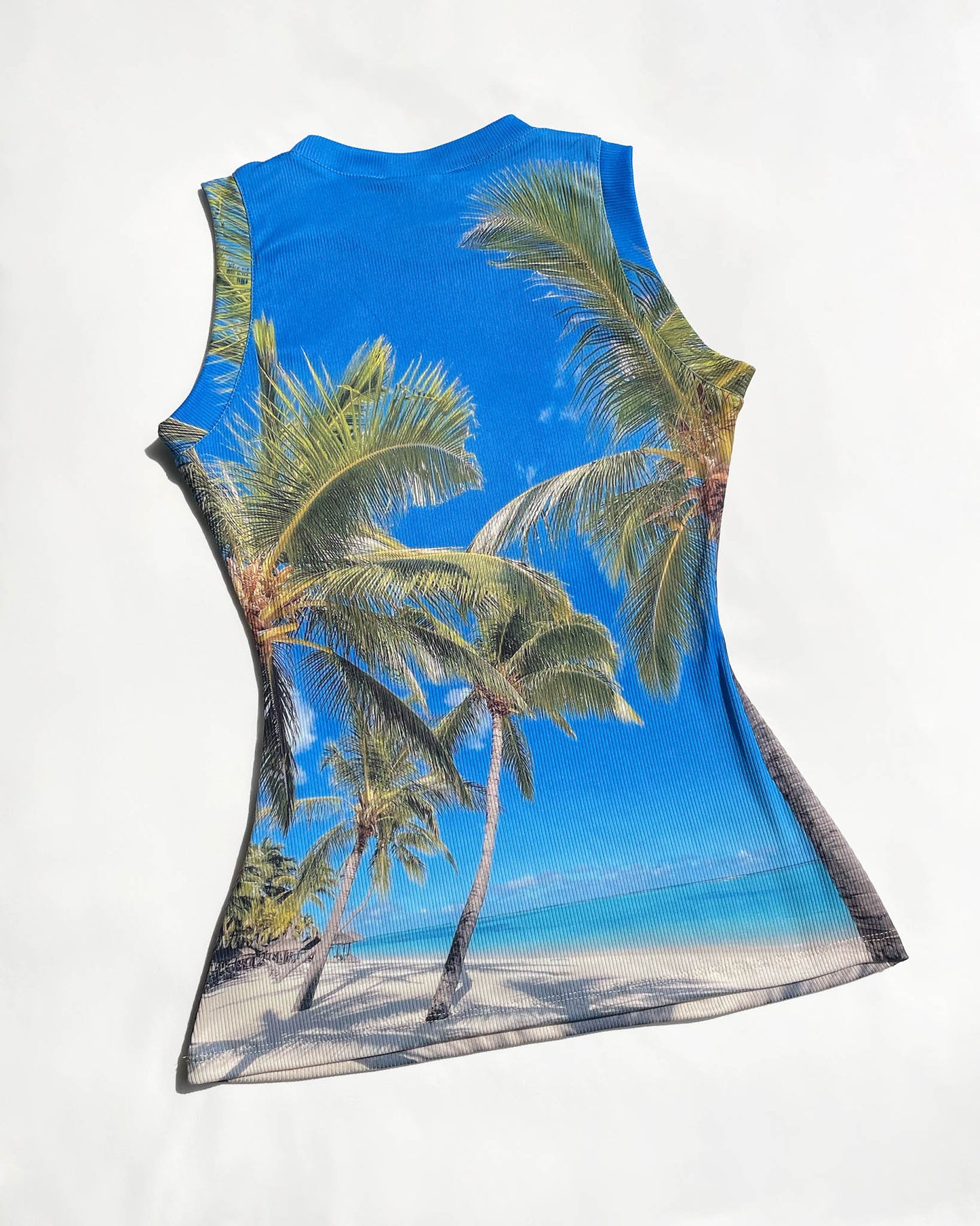 Back view of Tropical.jpeg Top by Chimera Lab laid flat showing digital palm beach print