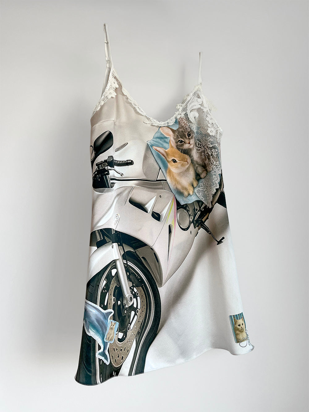 Silk slip dress with motorcycle and kitten, rabbit print on a white background.