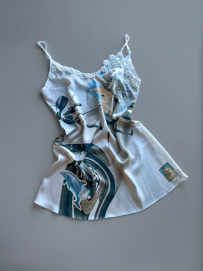 Mini Silk Slip Dress with a motorcycle and animal print with lace trim detailn on a grey background.