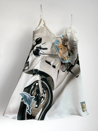 Mini Silk Slip Dress with a motorcycle and animal print on a white background.