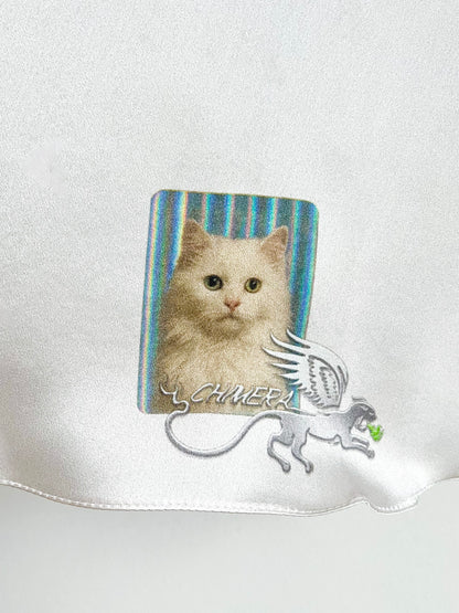 Silky material close-up with a cat design and CHIMERA brand logo on a white background.