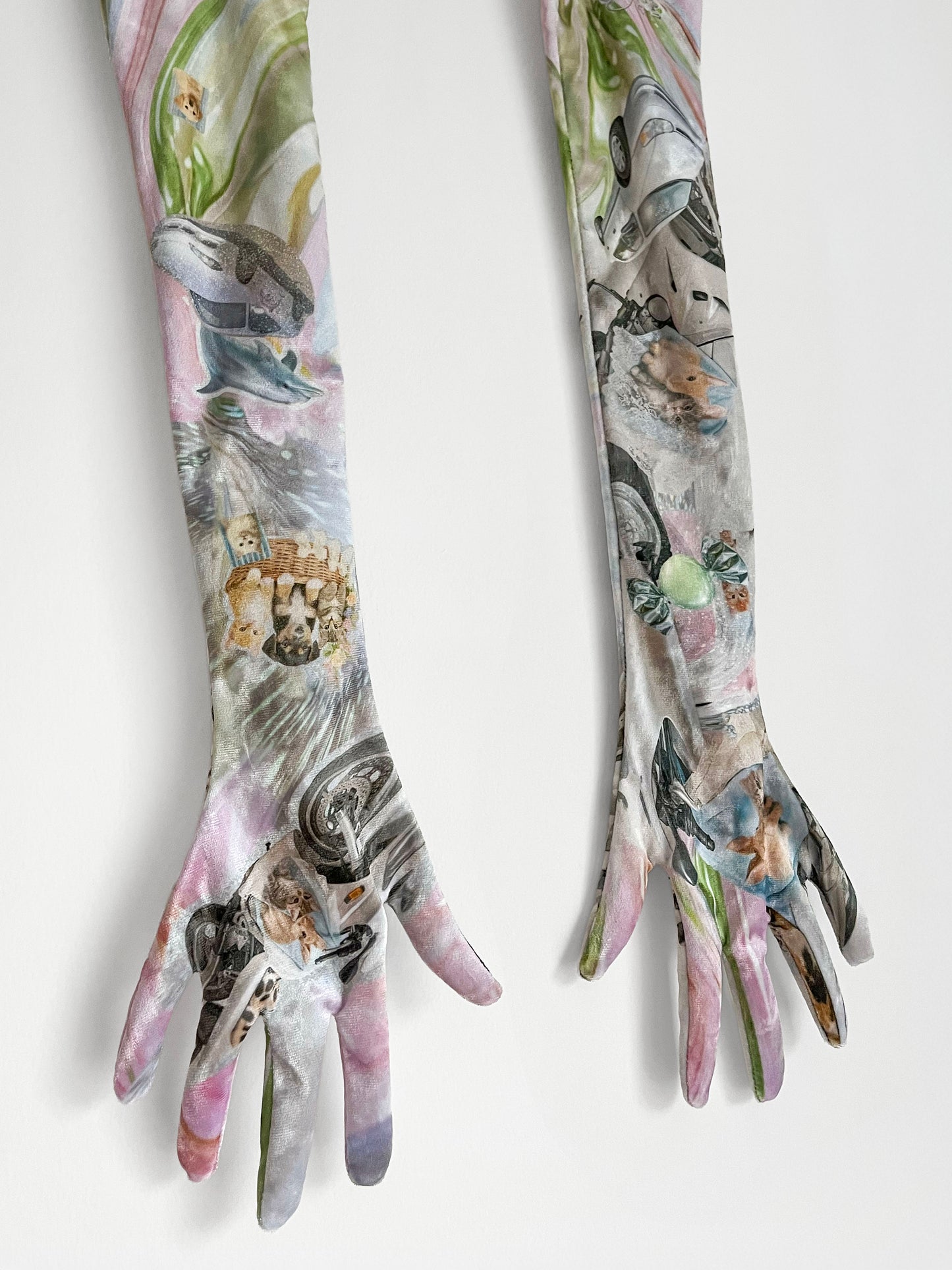 Pair of long gloves with artistic Y2K dolphin, cute puppy print design on a white background.