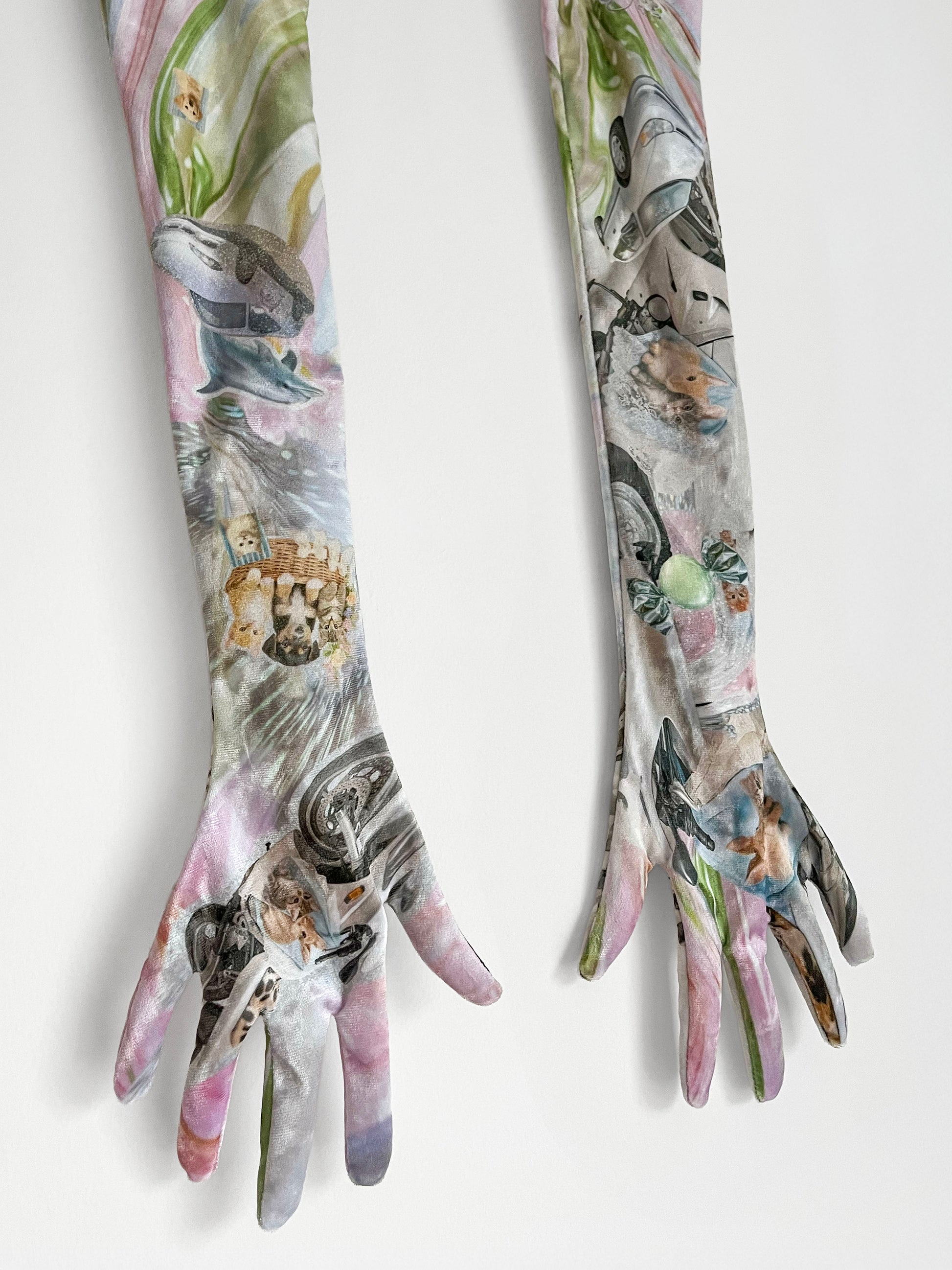 Pair of long gloves with artistic Y2K dolphin, cute puppy print design on a white background.