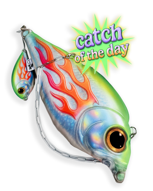 Trophy Fish Bag with holographic flame print and detachable chain strap on plain background, styled with retro “Catch of the Day” graphic text.