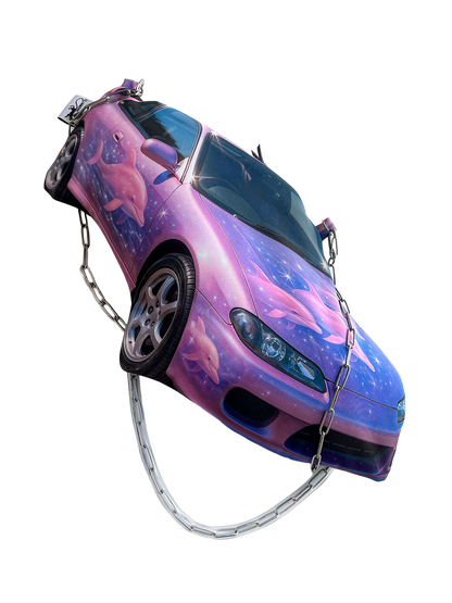 Purple and pink sports car shaped handbag with airbrushed dolphins and galaxy-style print, featuring a chain shoulder strap, by CHIMERA.
