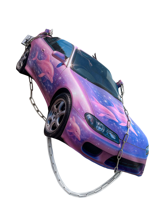 Purple and pink sports car shaped handbag with airbrushed dolphins and galaxy-style print, featuring a chain shoulder strap, by CHIMERA.