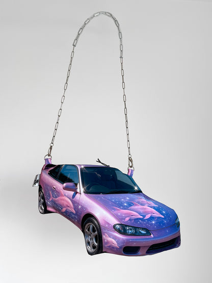 Y2K-inspired sports car handbag in purple and pink with airbrushed dolphin graphics and glossy photorealistic finish, chain strap, CHIMERA design.