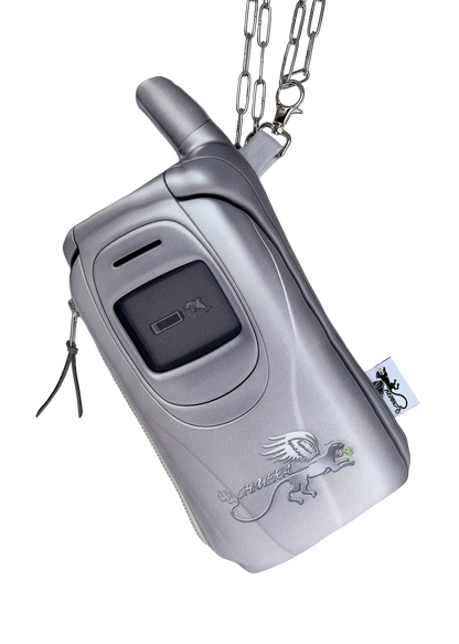 A silver flip phone-shaped pouch bag by CHIMERA with a chain strap, featuring a silver printed logo on the front, isolated on a white background.
