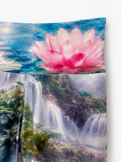 Close-up of the Zen Capri waistband with a pink lotus flower and waterfall print.