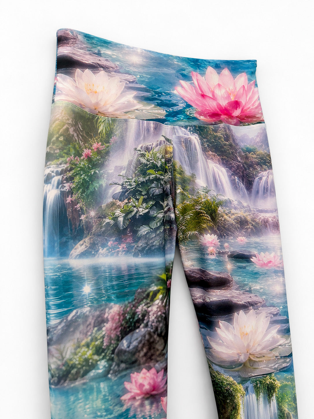 Close-up of the Zen Capri waistband and upper legs, showing waterfall scenery and lotus flowers.