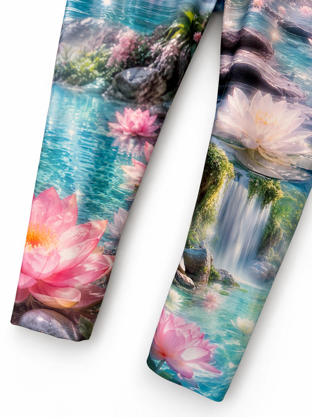 Close-up of both Zen Capri legs, showing pink and white lotus flowers and waterfall print.