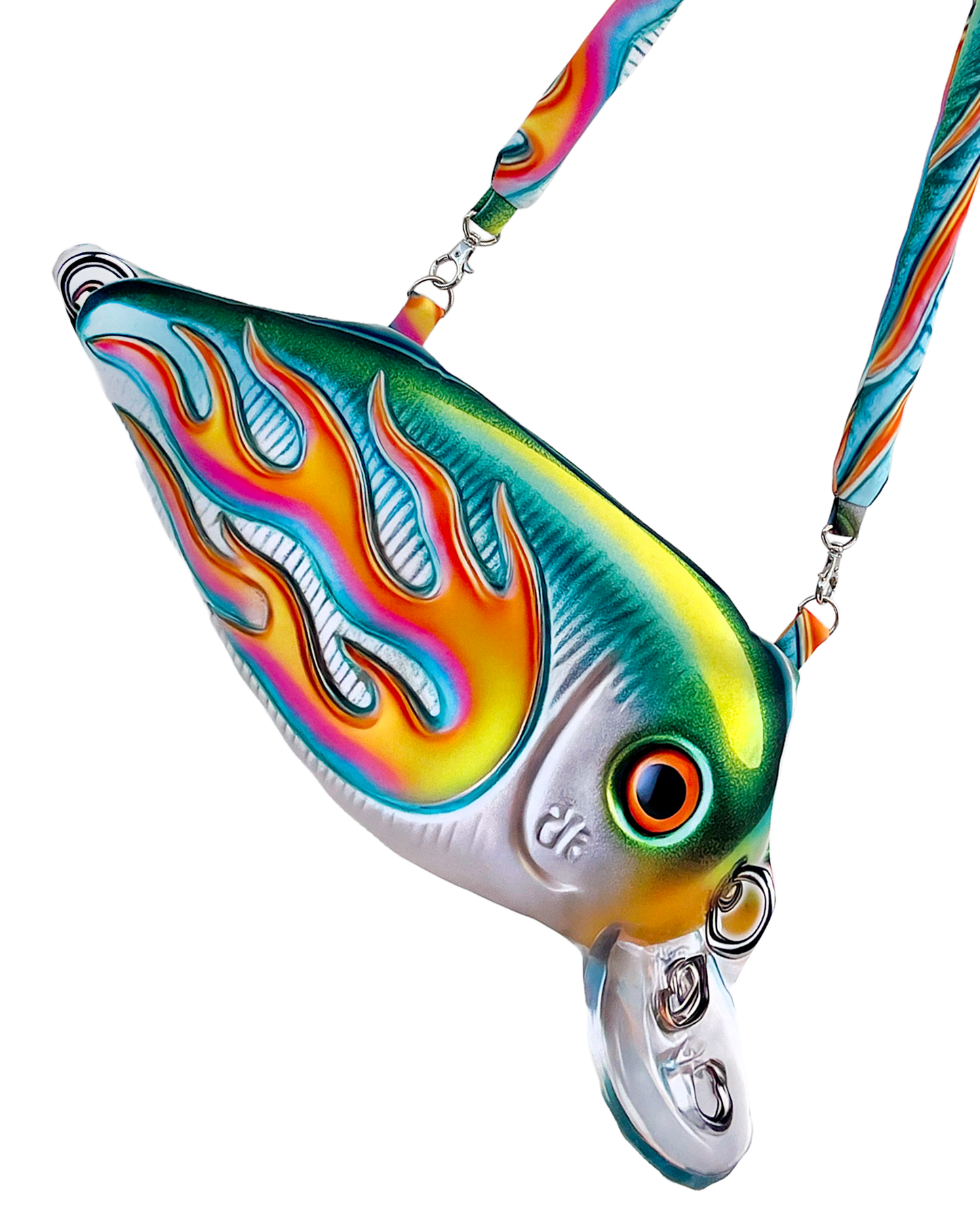 Close-up of the Moto Fish Bag by Chimera Lab, shaped like a 3D fishing lure with a chrome body and neon flame graphic, featuring a padded printed strap.