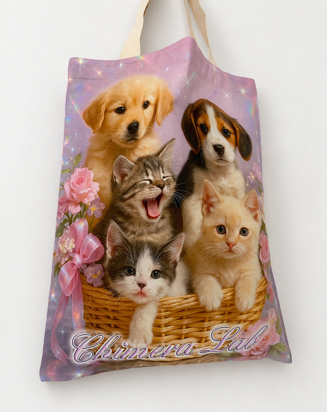 Other side of the Pet Calendar Tote Bag, showing two puppies and three kittens in a wicker basket, flowers and Chimera Lab lettering.
