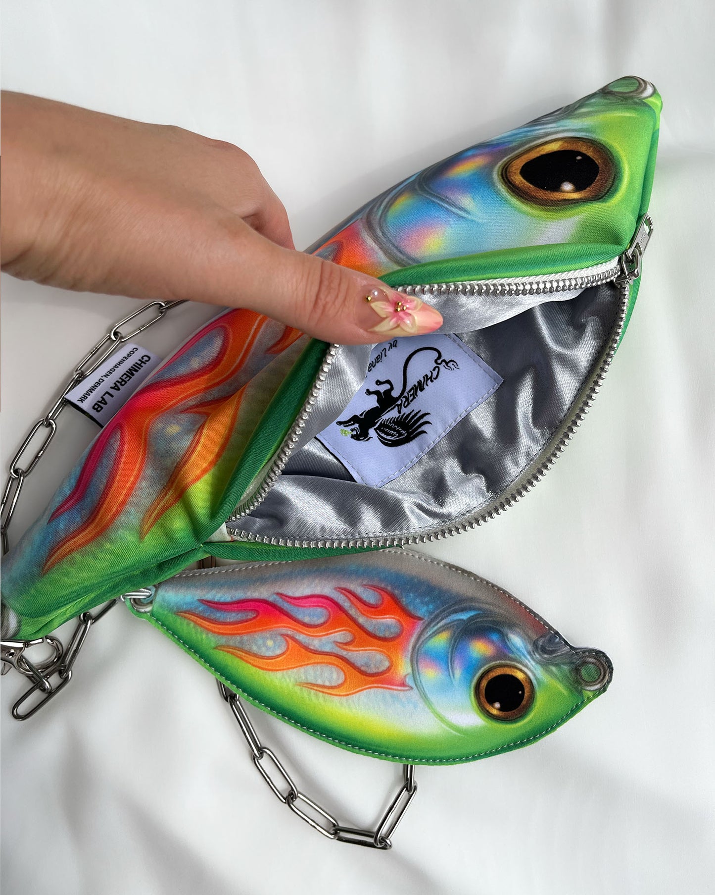 Interior view of Baby Trophy Fish pouch with silver satin lining and Chimera Lab label, zippered opening.