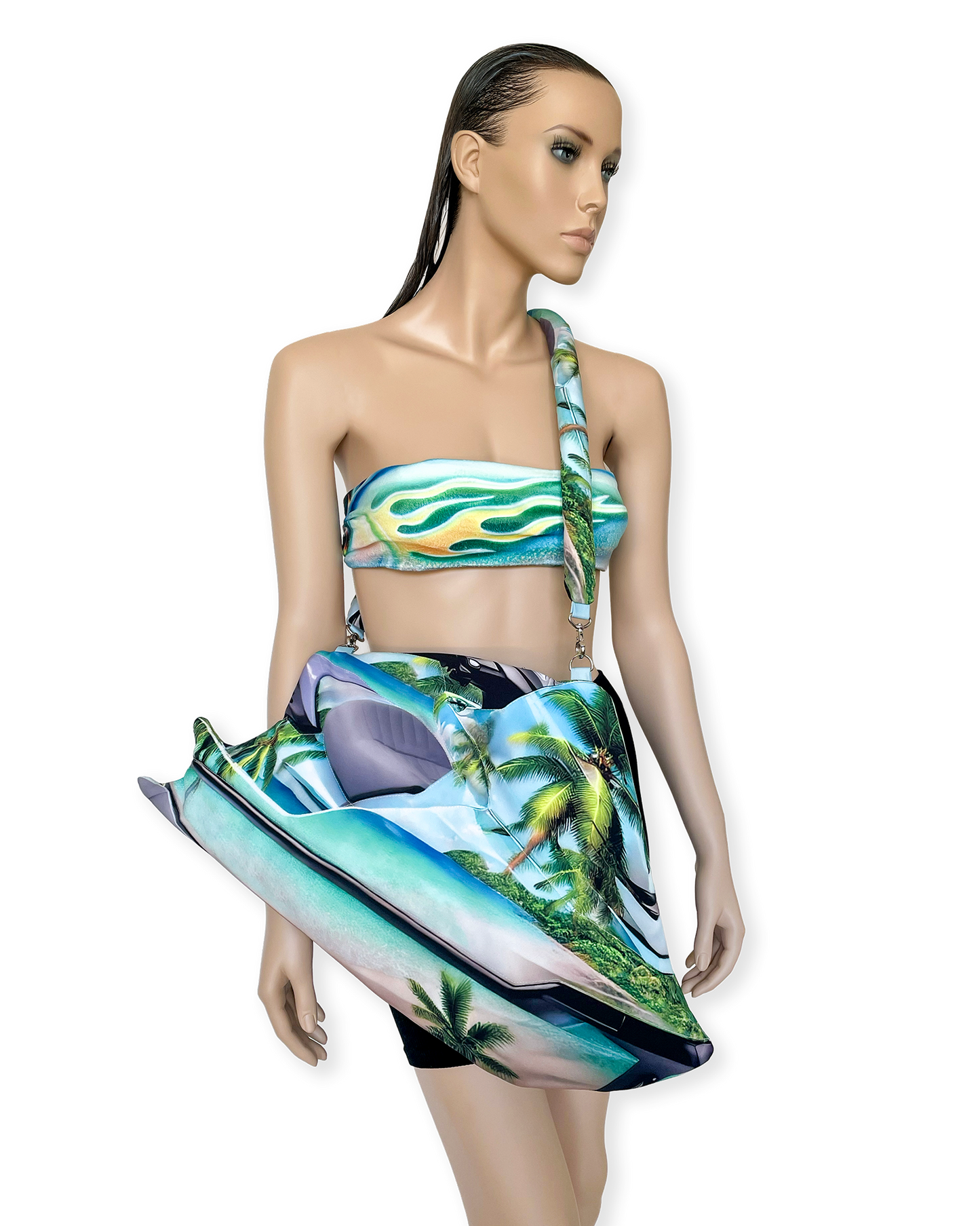 Mannequin styled with matching tropical flame bandeau top and sculptural Jetski Bag by Chimera Lab, featuring vivid beachscape print