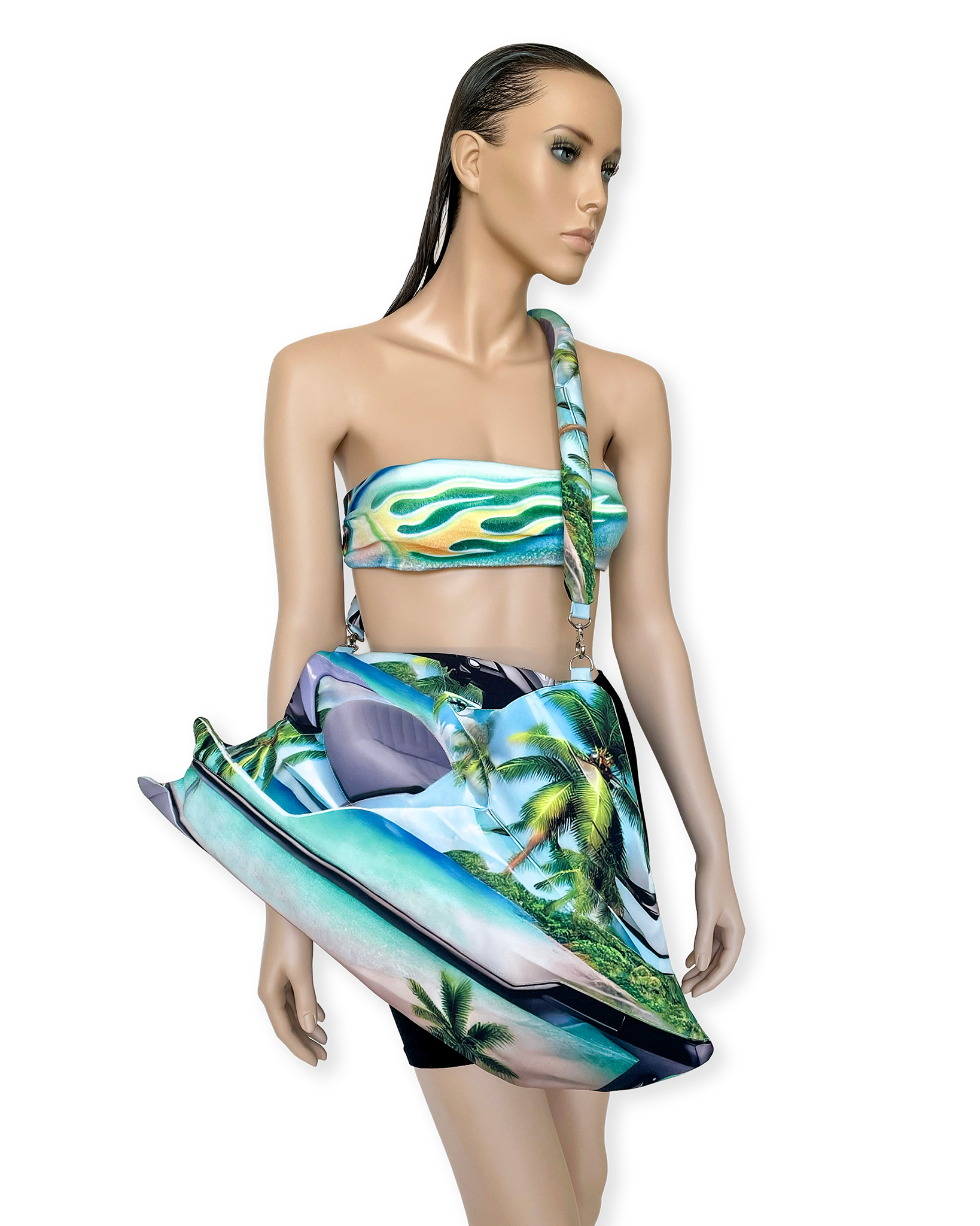 Mannequin styled with matching tropical flame bandeau top and sculptural Jetski Bag by Chimera Lab, featuring vivid beachscape print